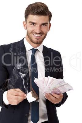 Wealthy successful businessman burning money