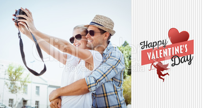 Composite image of stylish young couple taking a selfie