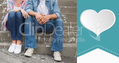 Composite image of hip young couple sitting on steps