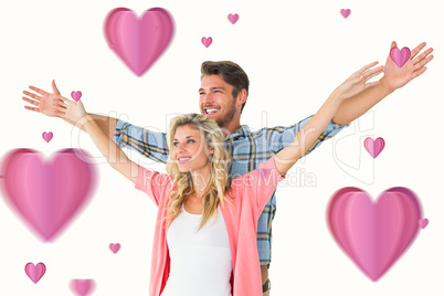 Composite image of attractive young couple standing with hands o