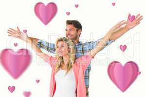 Composite image of attractive young couple standing with hands o