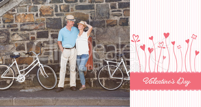 Composite image of happy senior couple going for a bike ride in
