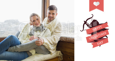 Composite image of couple in winter clothing sitting against cab