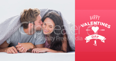 Composite image of attractive man kissing his wife