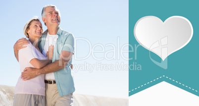 Composite image of happy senior couple embracing on the pier