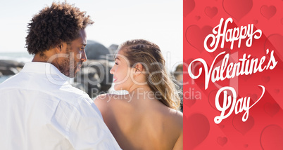 Composite image of gorgeous couple embracing by the coast