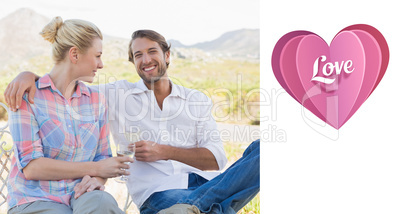 Composite image of cute couple sitting in the garden enjoying wi