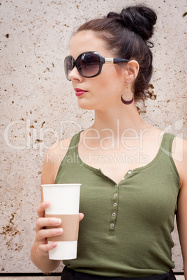 attractive young woman with smartphone and sunglasses outdoor