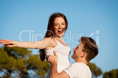 attractive couple in love summertime on beach