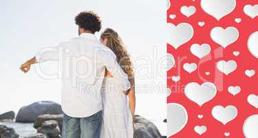 Composite image of gorgeous couple looking out to sea