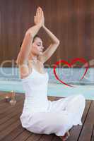 Composite image of content brunette in white sitting in lotus po