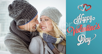 Composite image of cute couple in warm clothing smiling at each