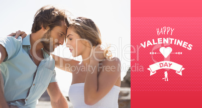 Composite image of gorgeous couple embracing at the coast