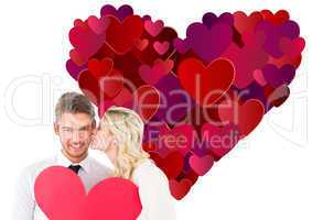 Composite image of attractive young couple holding red heart