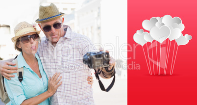 Composite image of happy tourist couple taking a selfie in the c