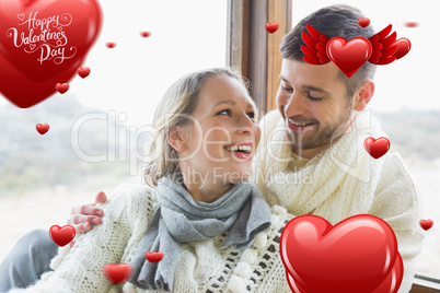 Composite image of cheerful young couple in winter clothing