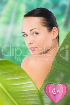 Composite image of beautiful nude brunette posing with green lea