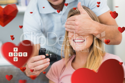 Composite image of man about to propose to his girlfriend on the