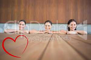Composite image of cheerful young women in swimming pool