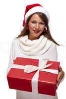 Pretty woman in a Santa hat with a large gift