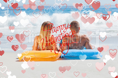 Composite image of cute couple in swimsuit sunbathing together
