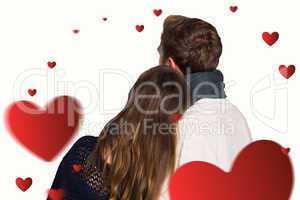 Composite image of close up rear view of romantic couple