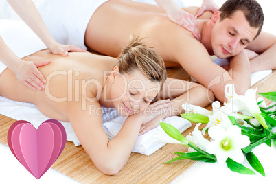 Composite image of loving young couple enjoying a back massage