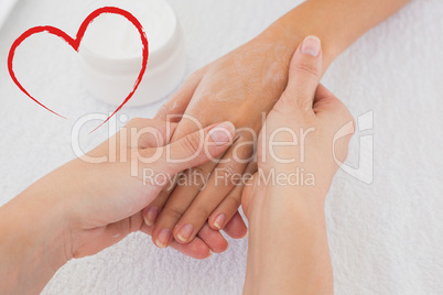 Composite image of hands applying cream