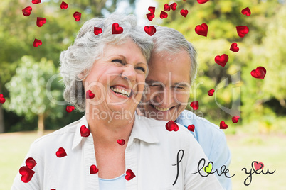 Composite image of happy mature couple laughing