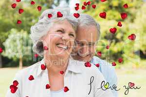 Composite image of happy mature couple laughing