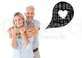 Composite image of happy couple standing and hugging