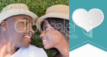 Composite image of happy couple lying in garden together