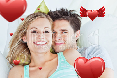 Composite image of portrait of an attractive couple hugging and