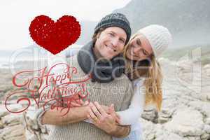 Composite image of romantic couple standing together on rocky la