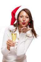 Playful woman celebrating Xmas blowing a kiss