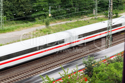 Fast moving train with red stripe