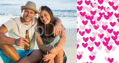 Composite image of smiling couple embracing while having a drink
