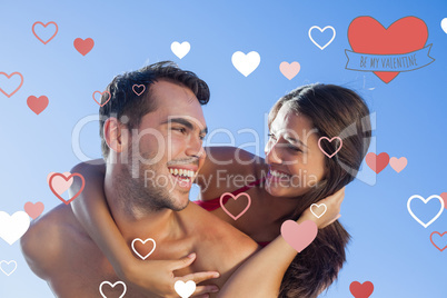 Composite image of handsome man carrying his girlfriend on his b