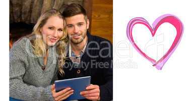 Composite image of lovely couple using tablet pc at