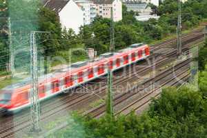 Fast moving train with red stripe