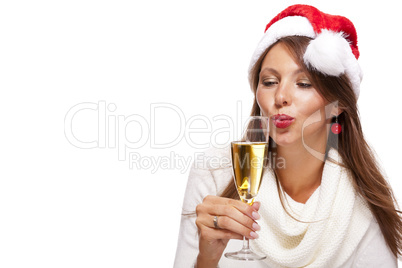 Playful woman celebrating Xmas blowing a kiss