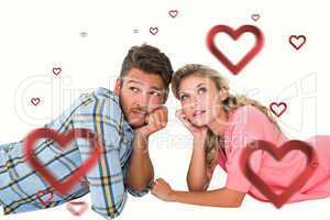 Composite image of attractive young couple lying and thinking