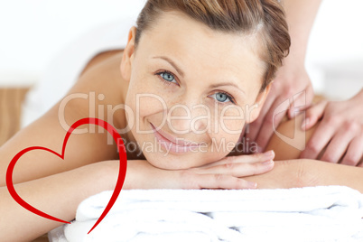 Composite image of charming woman enjoying a back massage