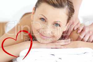 Composite image of charming woman enjoying a back massage