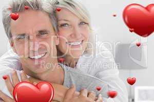 Composite image of affectionate couple smiling