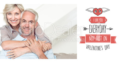Composite image of smiling woman embracing mature man from behin