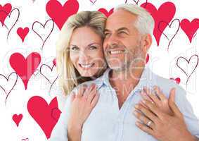 Composite image of smiling couple embracing with woman looking a