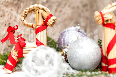 Silver Christmas bauble on a tree with snow