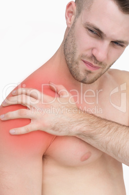 Closeup of shirtless man with shoulder pain