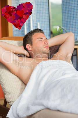 Composite image of man relaxing at the spa